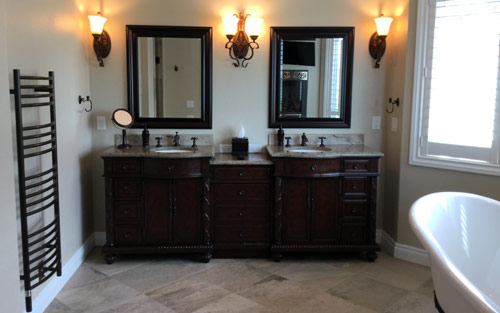 Luxury home bathroom remodel with double sink custom cabinet vanity, tile and clawfot bathtub by Mountain View Corporation in Boulder Colorado