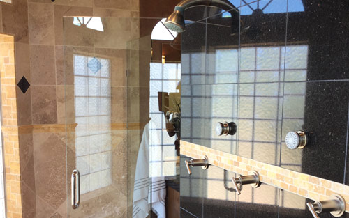 Bathroom shower remodel with custom tile work and glass door by Mountain View Corporation in Parker Colorado